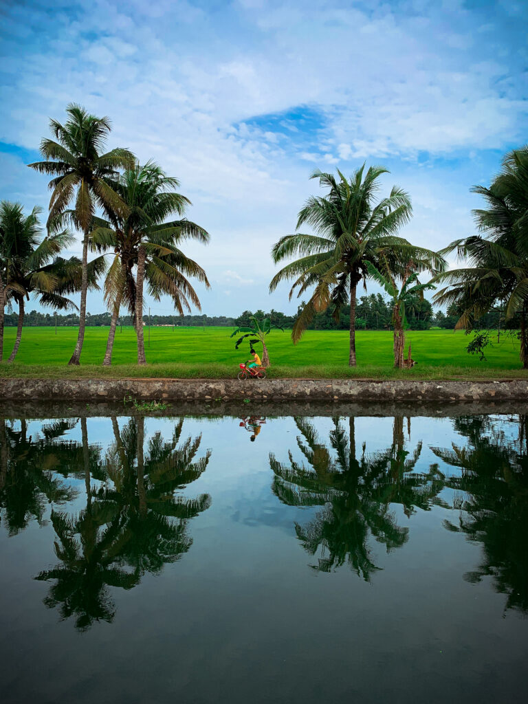 kid-driving-bike-bank-river-kerala